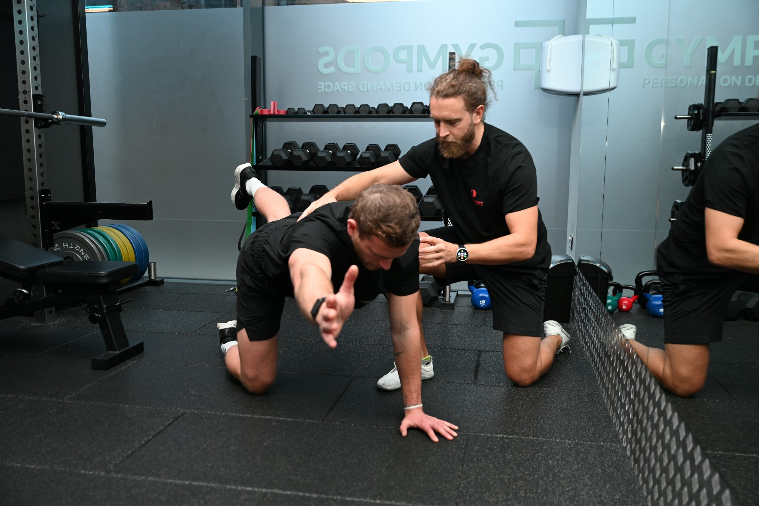 Osteopath guiding exercise rehabilitation and movement coaching